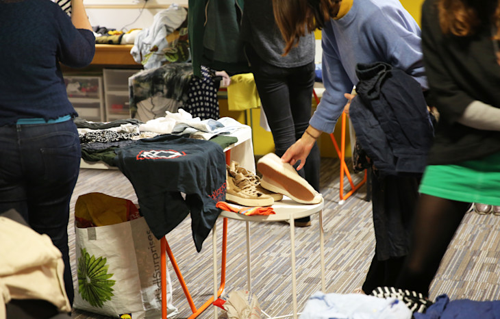 A keen bulb member considering a pair of shoes at the Bulb Clothes Swap.