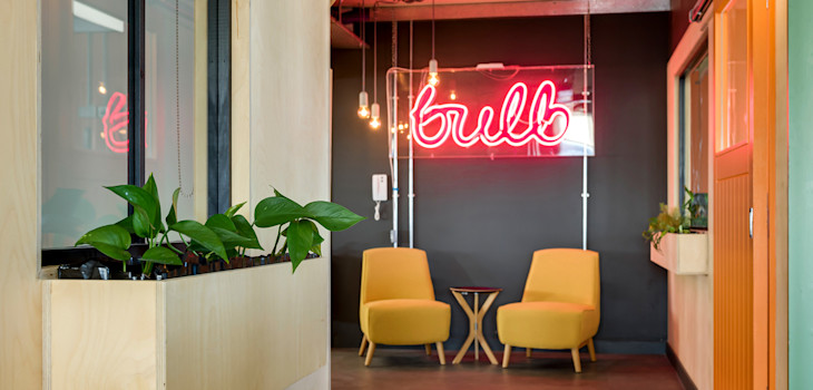 Bulb neon sign in the Brighton office space