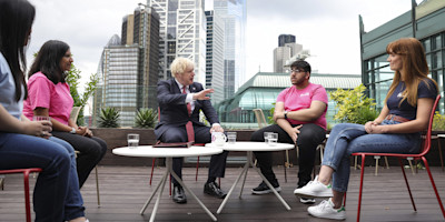 Boris Johnson talking to Bulb employees on the roof terrace at Bulb's offices in London.
