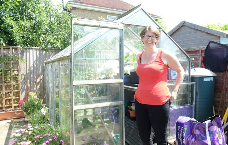 Photo of a Bulb member standing in her garden
