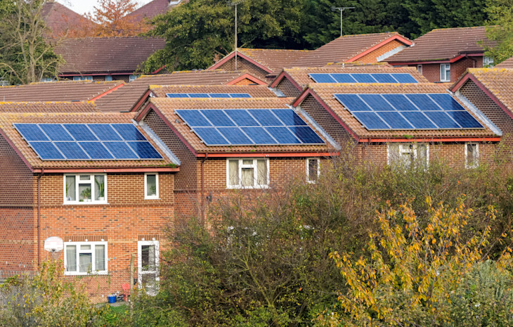 A picture of homes with solar panels.
