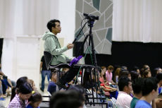 Camera operator filming the conference at Christ Fellowship Church International (CCFI)