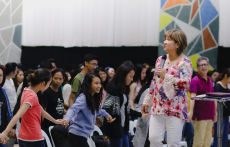 Cristina Sosso standing before the crowd at Christ Fellowship Church International (CCFI) in General Santos City.