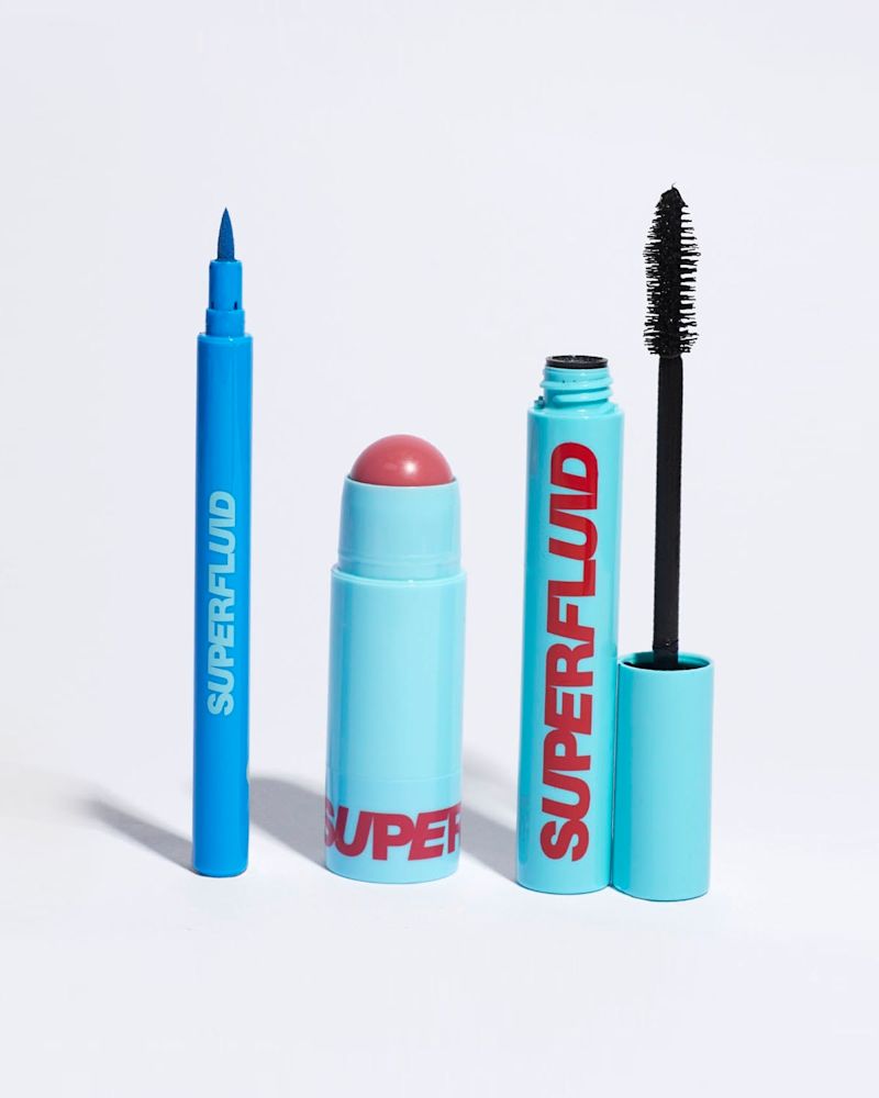open packs of azure eye liner, mauve lip and cheek tint and black mascara
