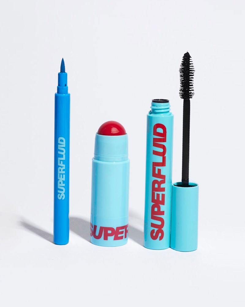 open packs of azure eye liner, red lip and cheek tint and black mascara