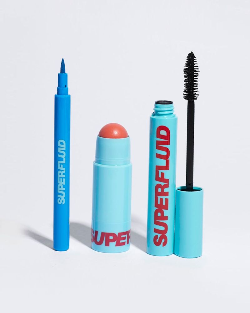 open packs of azure eye liner, coral lip and cheek tint and black mascara