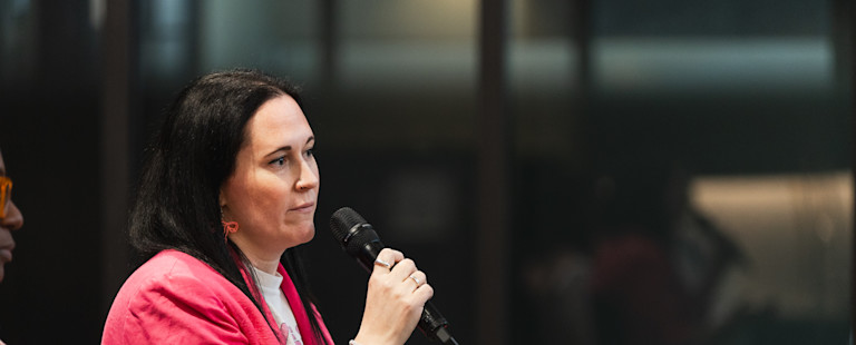 Woman pitching to investors.