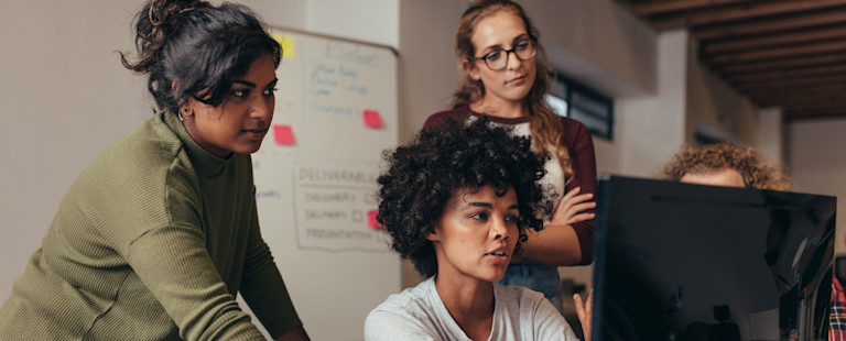 Startup team working on the computer.