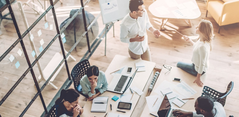 overhead view of people working around a table