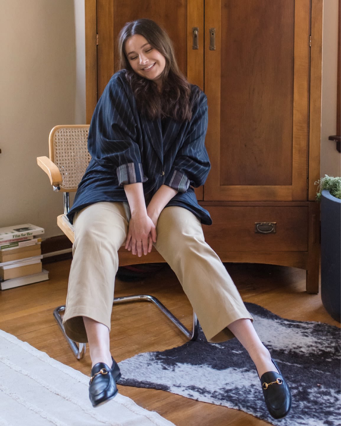 GIRL LAUGHING IN A BLAZER.