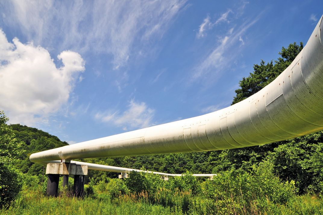 Photo of a bended pipeline in nature
