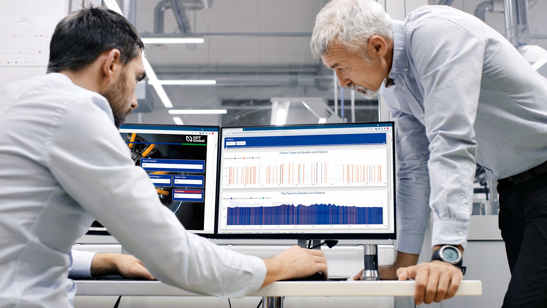 Two men looking at OPTIX screens