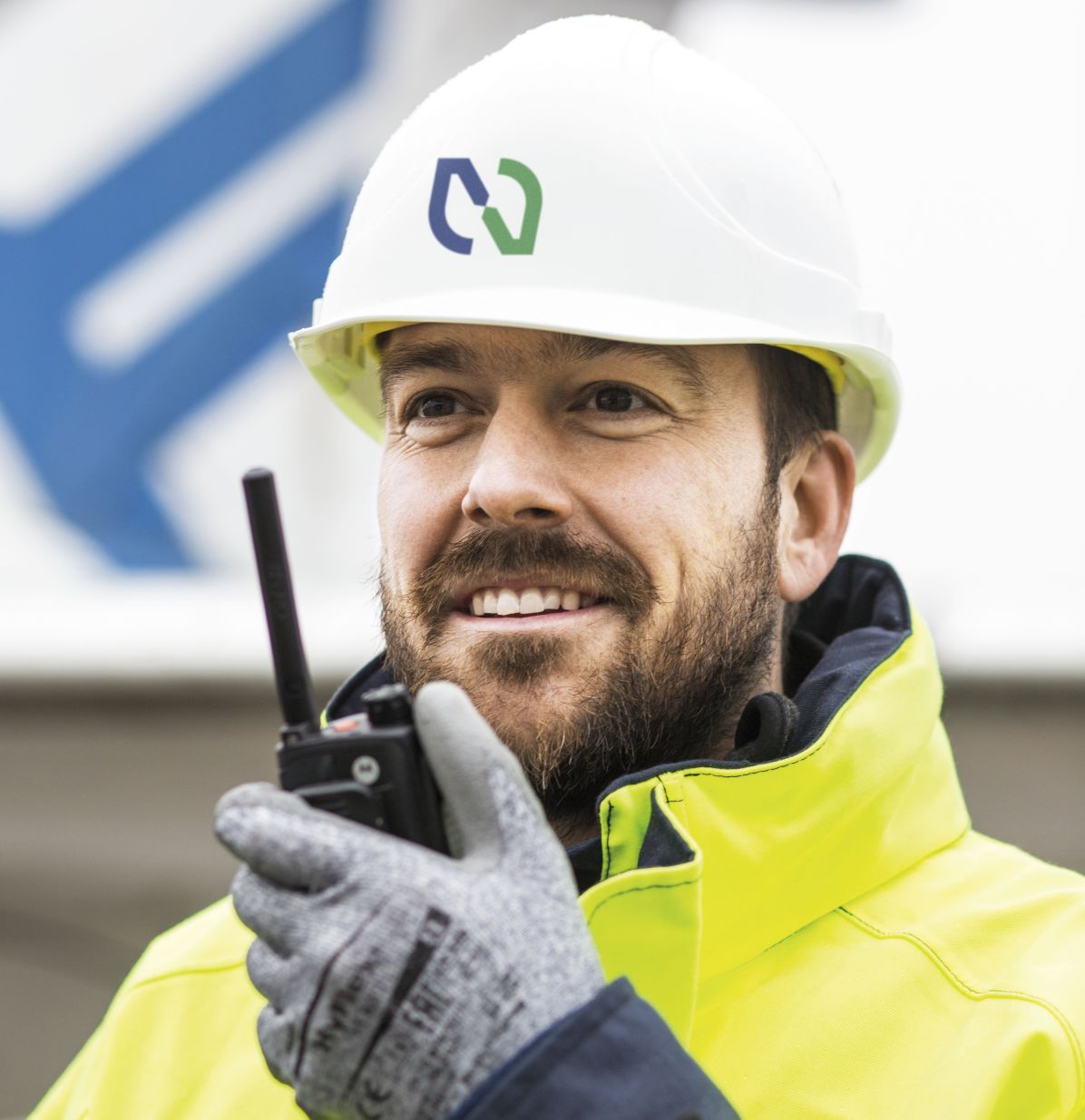 Man on pipeline operation with walkie talkie