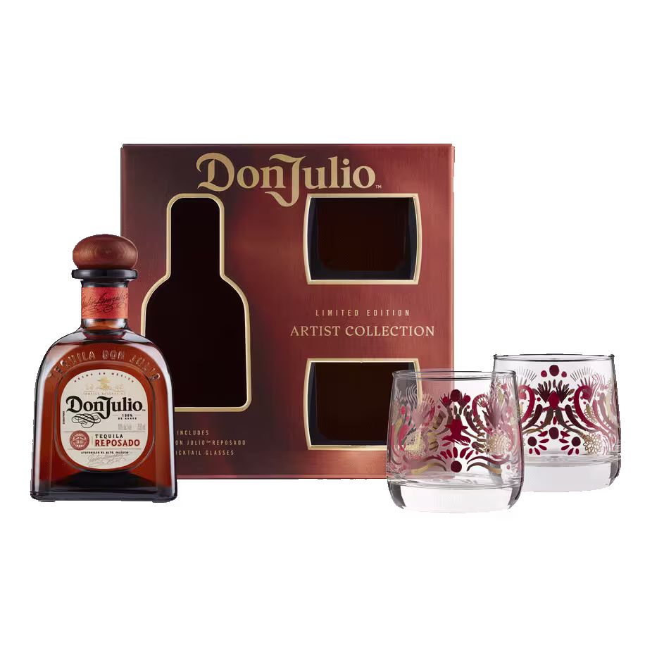 A Don Julio Reposado tequila bottle, two decorated glasses, and a limited edition Artist Collection gift box are displayed against a white background.