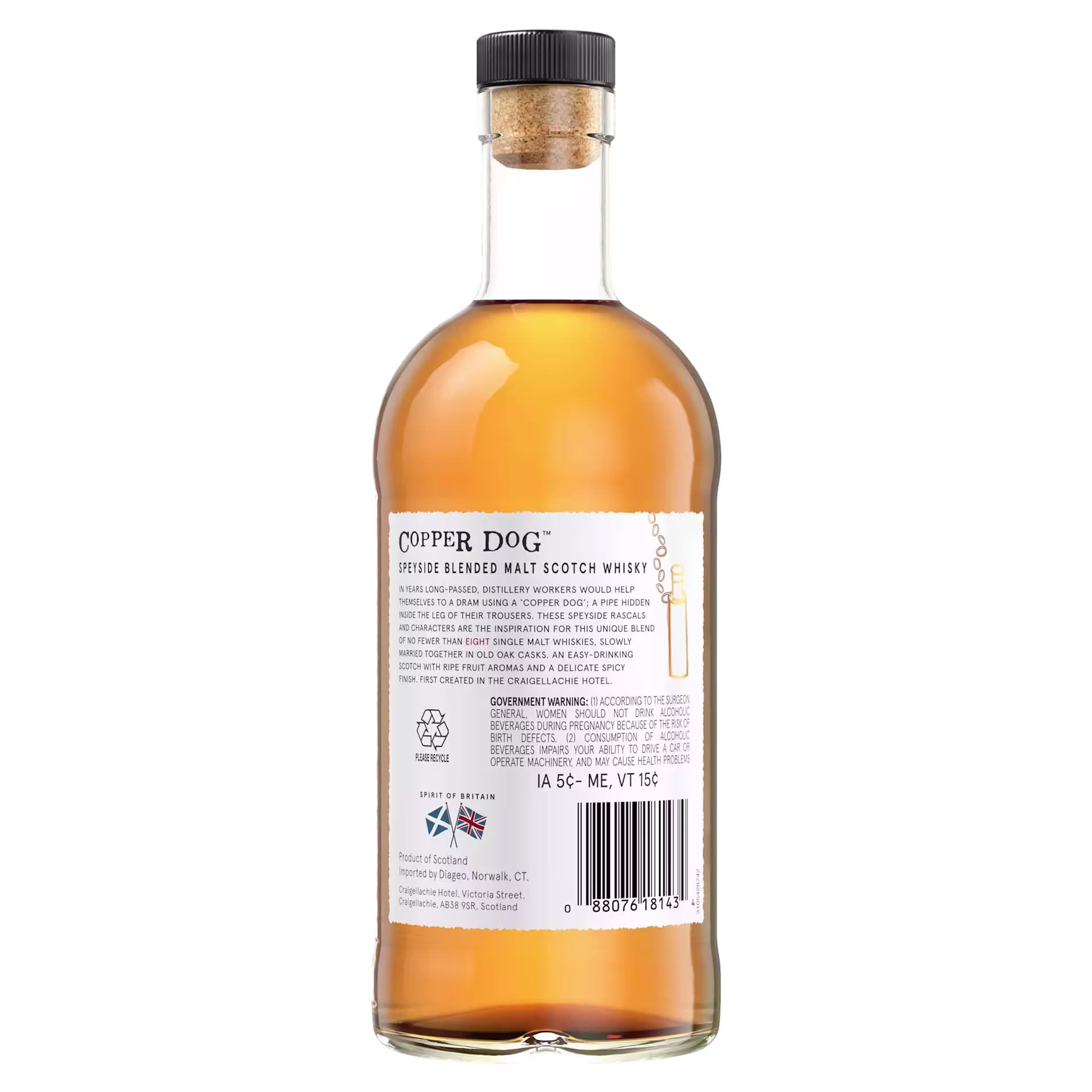 A clear glass bottle of Copper Dog blended malt scotch whisky with a cork top, showing the back label with product details and barcode.