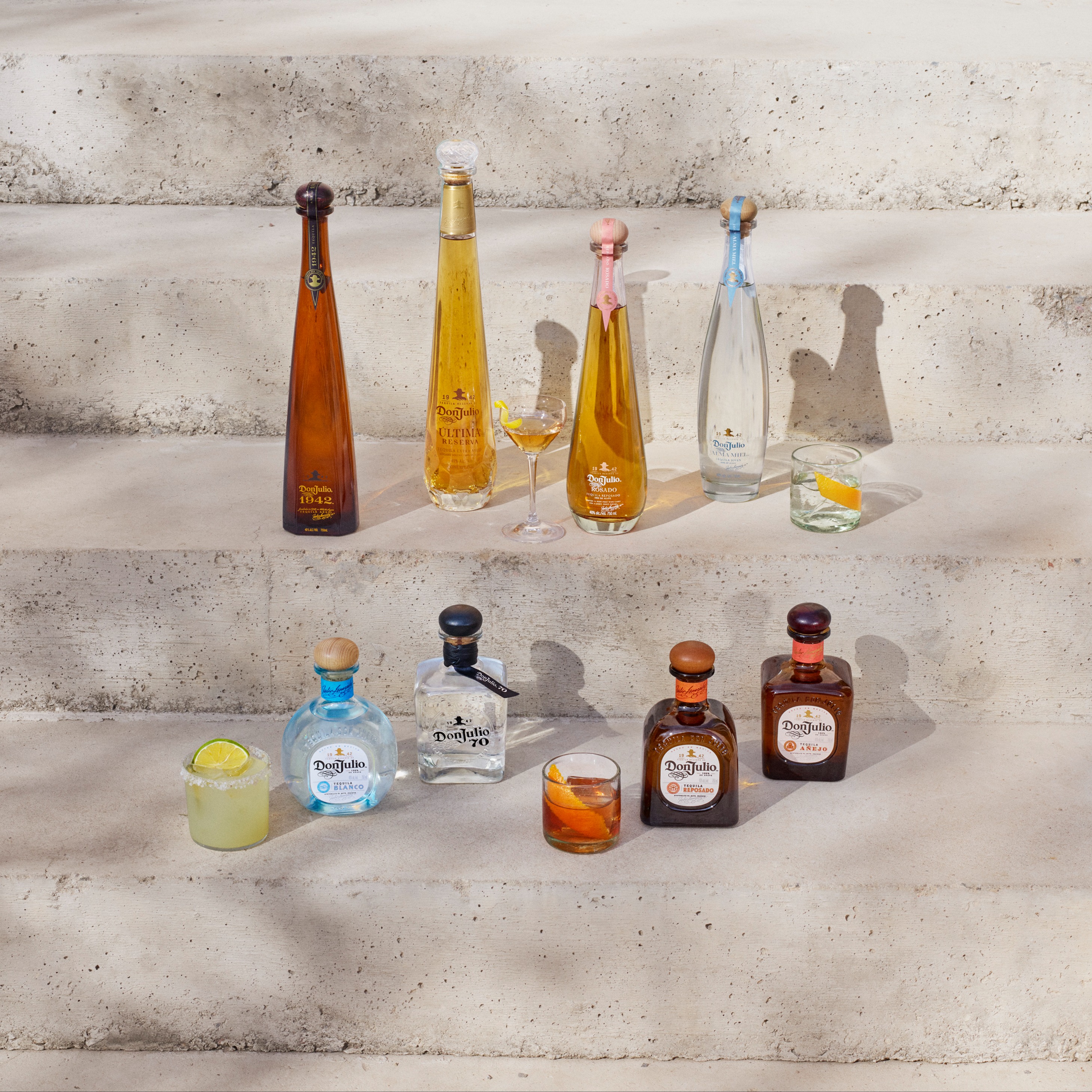 Don Julio bottles next to cocktails