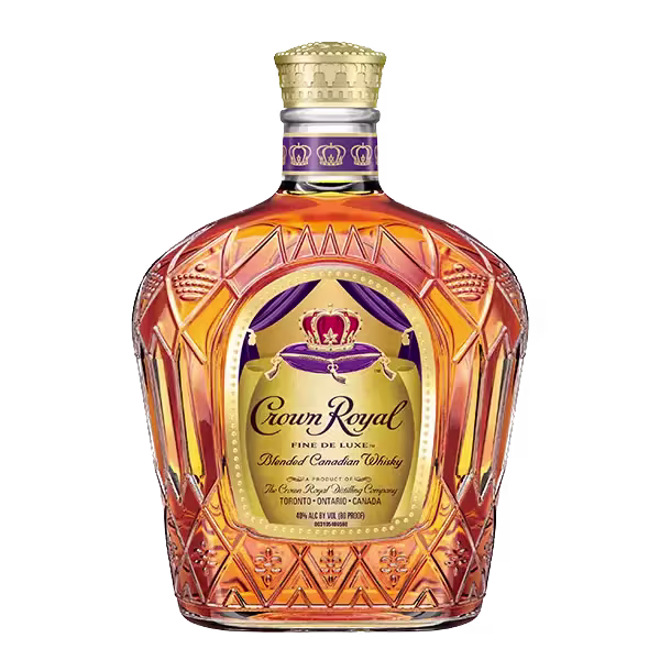 A bottle of Crown Royal Fine De Luxe Blended Canadian Whisky with a gold and purple label and a decorative glass design.