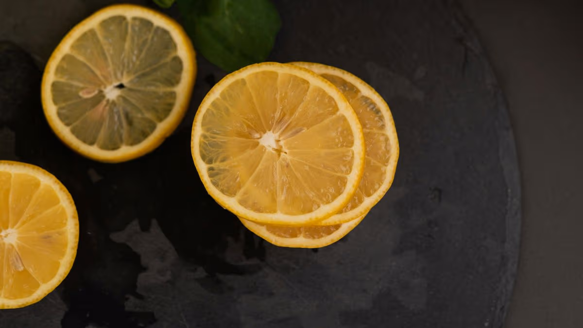 Slices of Lemon and mint on slate cutting board