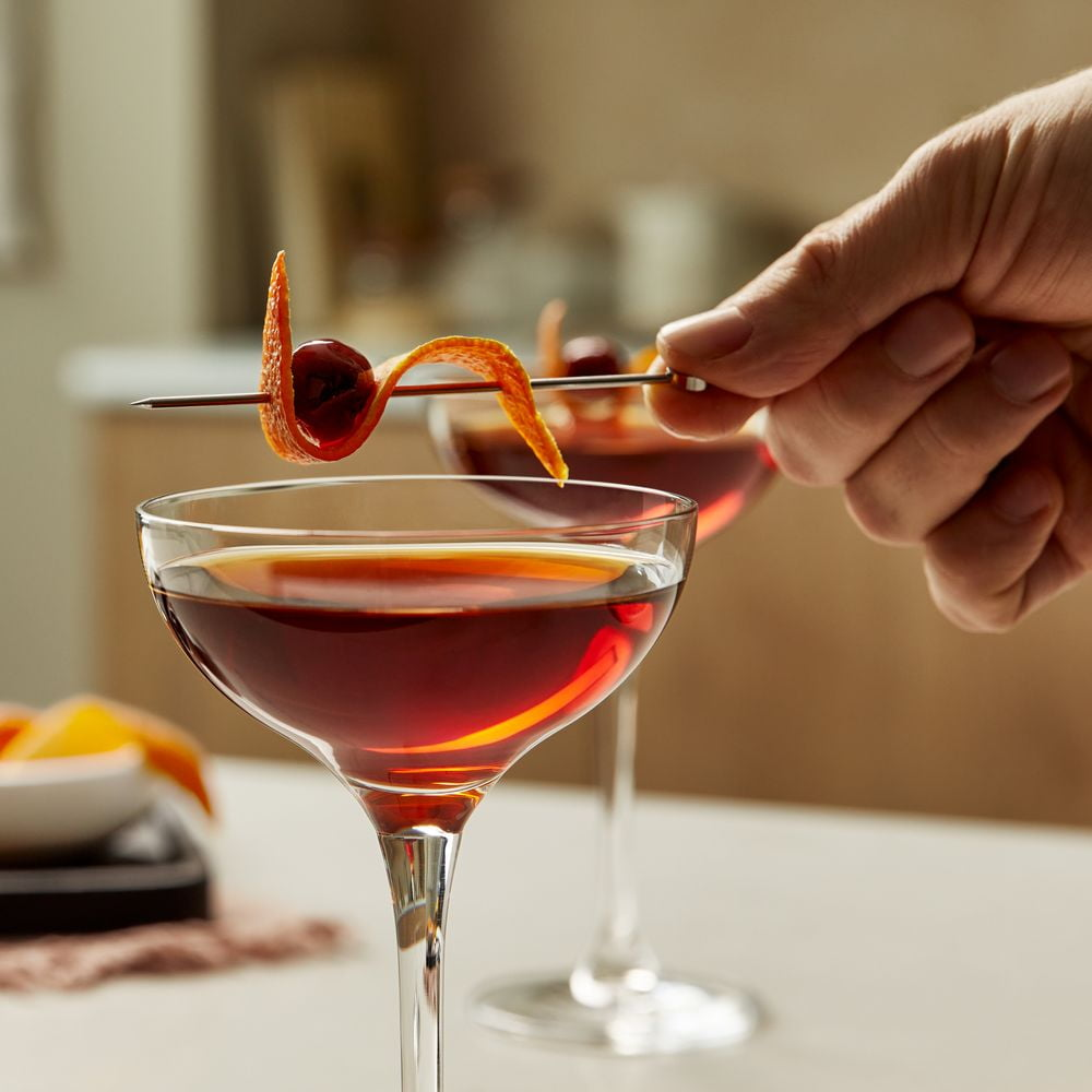 Manhattan whisky made with Old Parr 12 Year Blended Scotch Whisky, served with fruit garnish