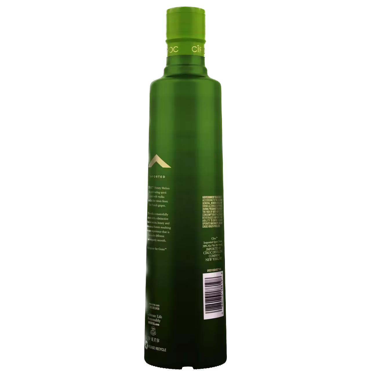 A green bottle photographed from the back, showing product information and a barcode on the label.