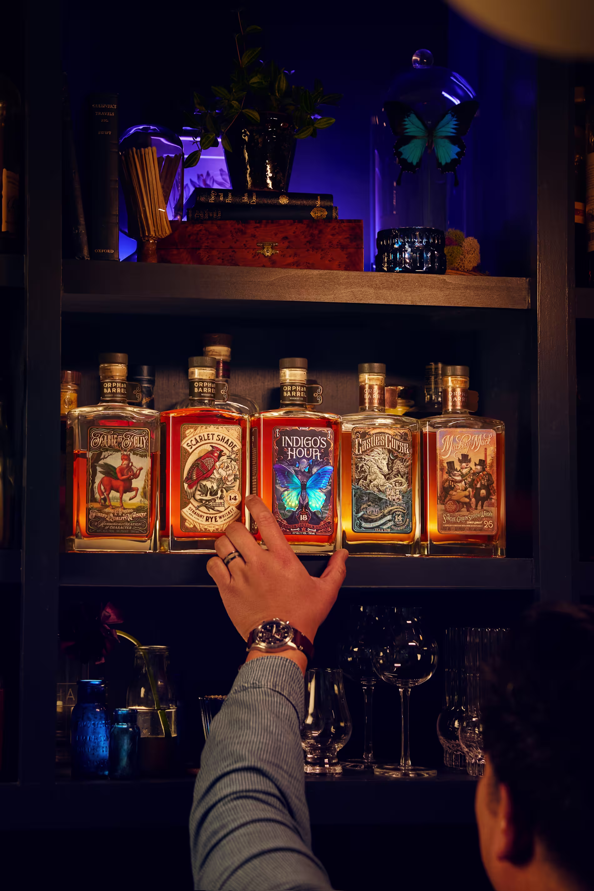 Collection of Orphan Barrel whiskey bottles including Entrapment, Rhetoric, and other rare editions.