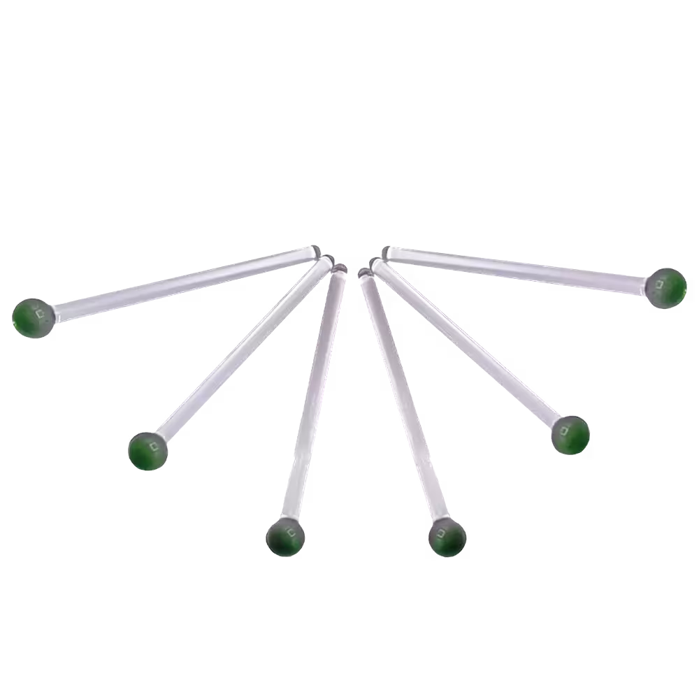 Seven identical white rods with green circular ends are arranged in a fan shape against a black background.