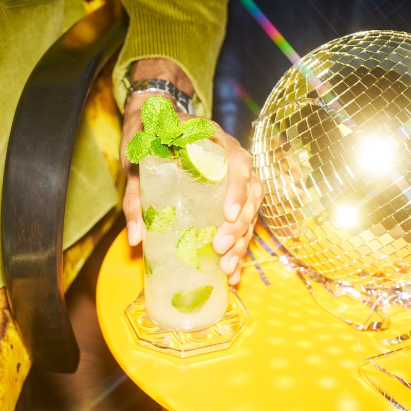 Tequila-based mojito cocktail on a table.
