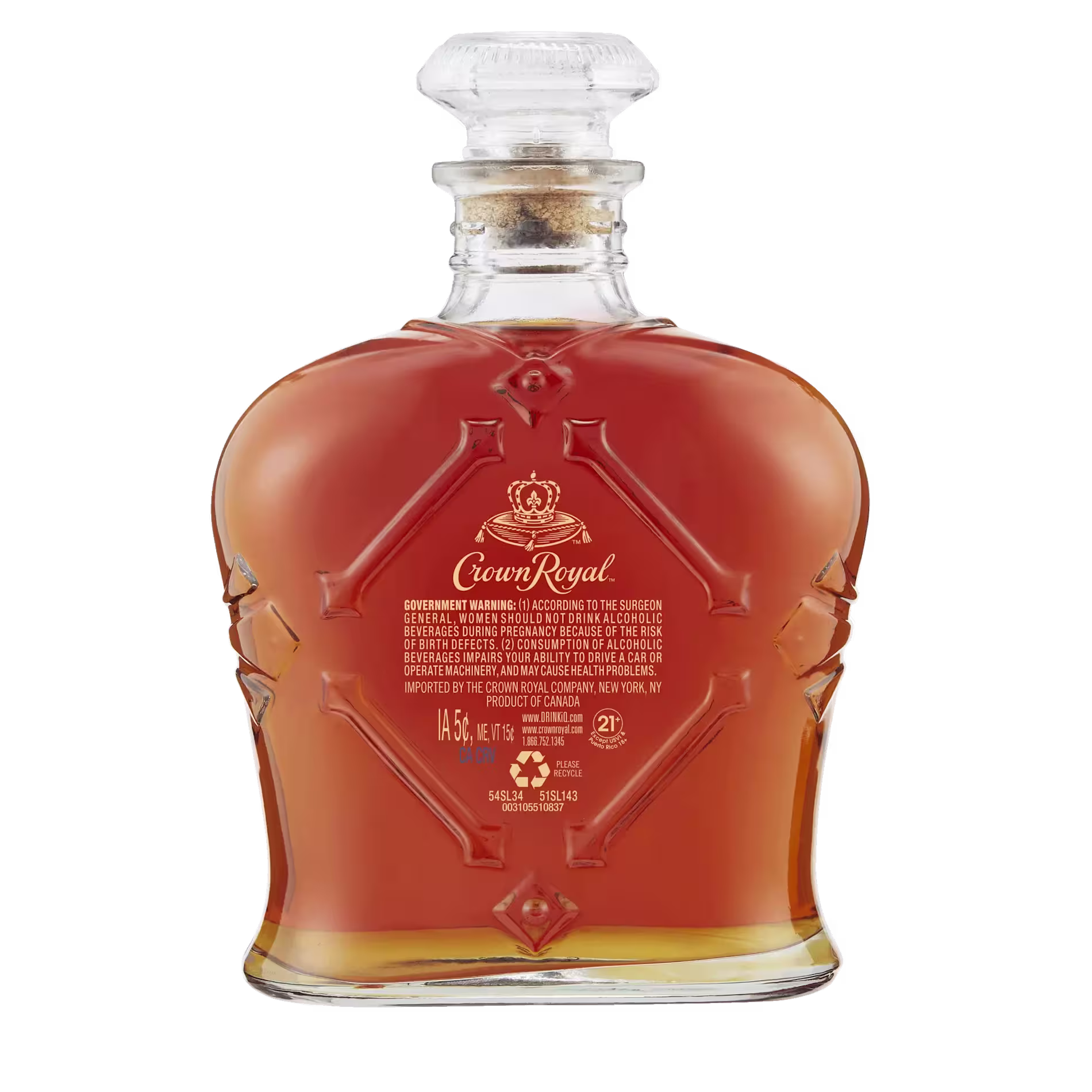 A clear glass bottle of Crown Royal whisky with a gold label, filled with amber liquid, set against a white background.
