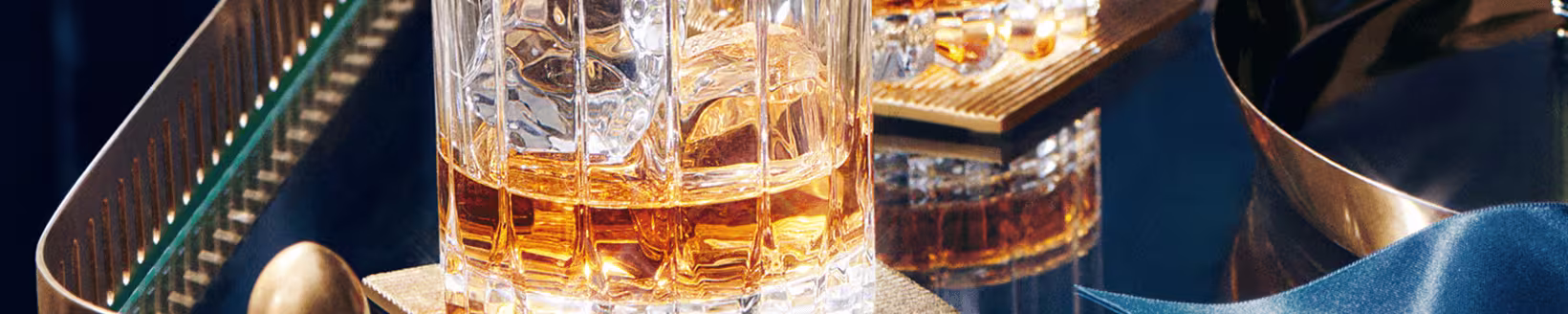 Close-up of Johnnie Walker whisky served in crystal glasses on a luxurious setup