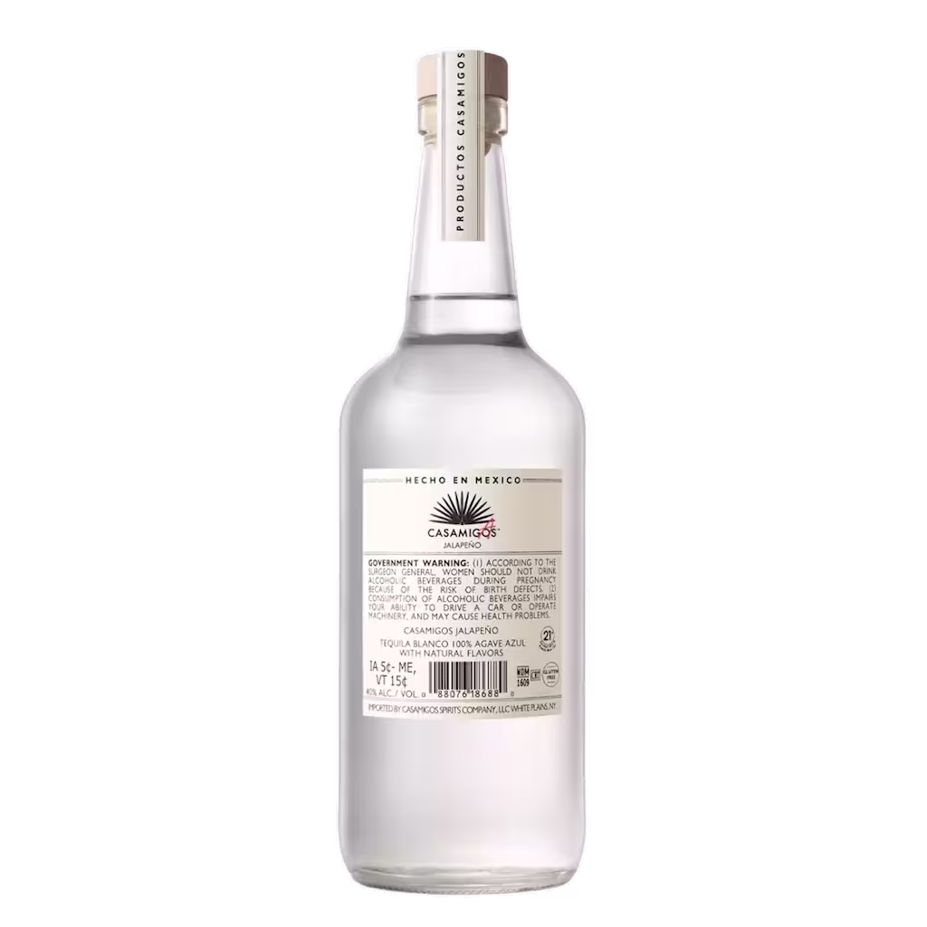 A clear glass bottle of Casamigos Blanco Tequila shown from the back, displaying the label with product information and warnings.
