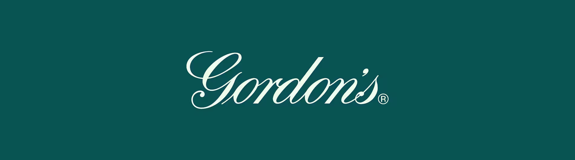 Gordon’s gin logo in white on dark green background