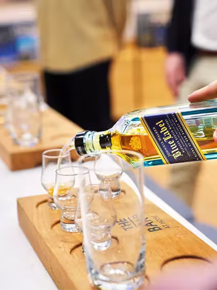 Johnnie Walker Blue Label Whisky being poured into tasting glasses
