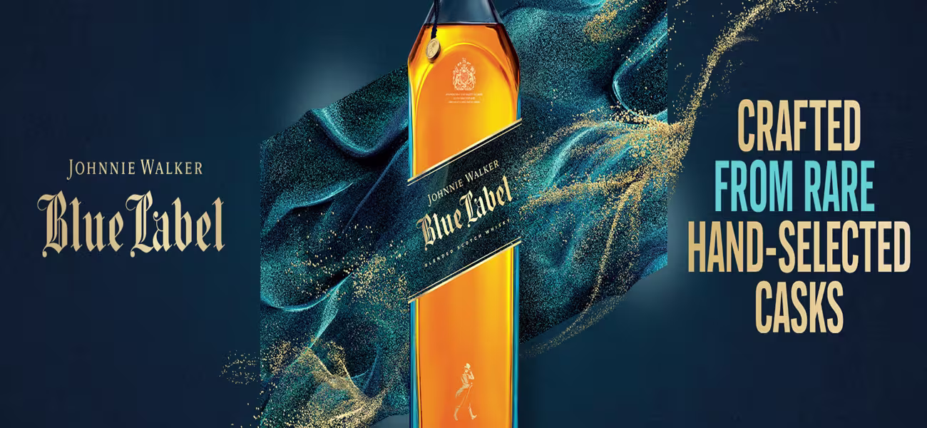 A full page-width banner depicting the Johnnie Walker Blue Label bottle and text 'crafted from rare hand-selected casks'