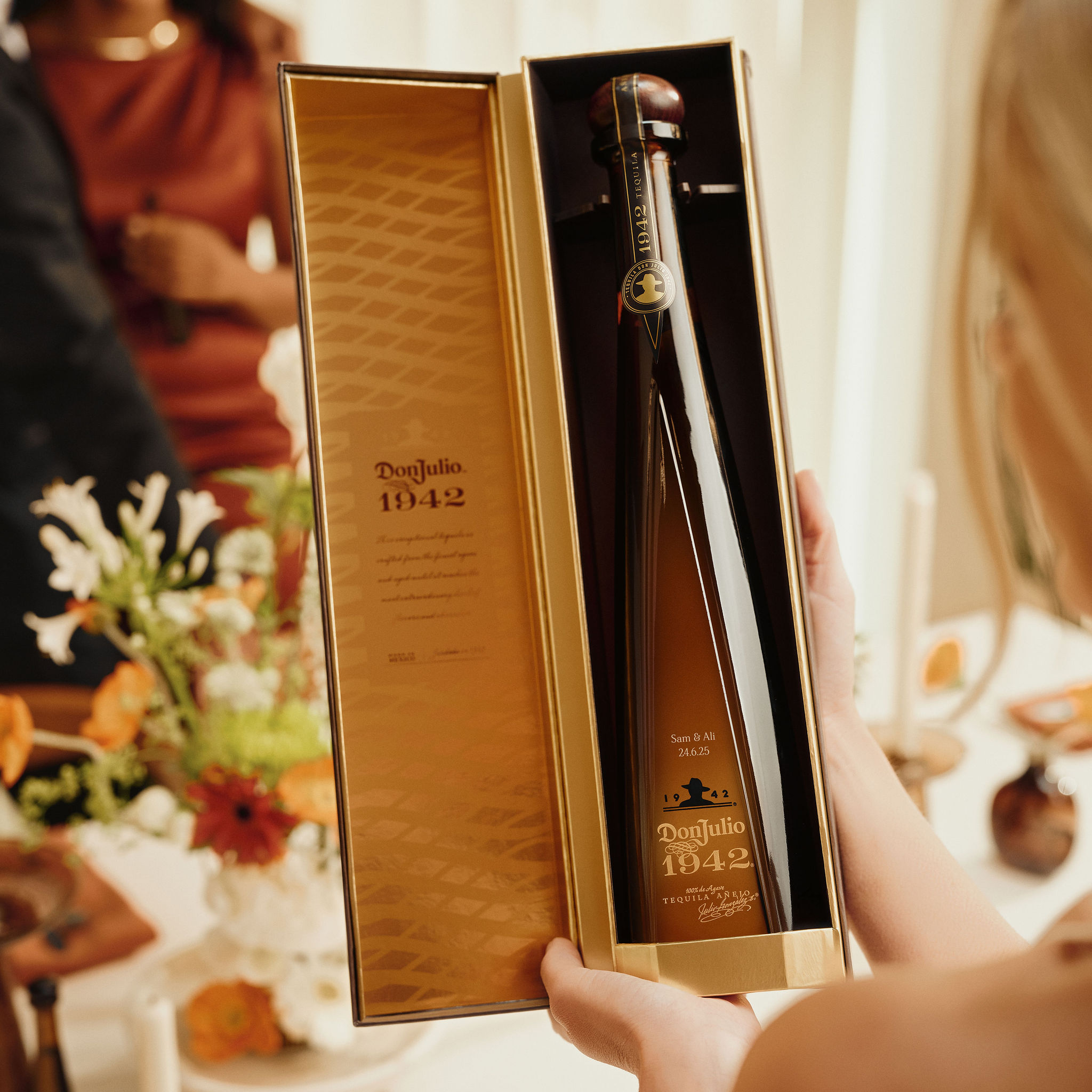 Bride holding a bottle of Don Julio 1942