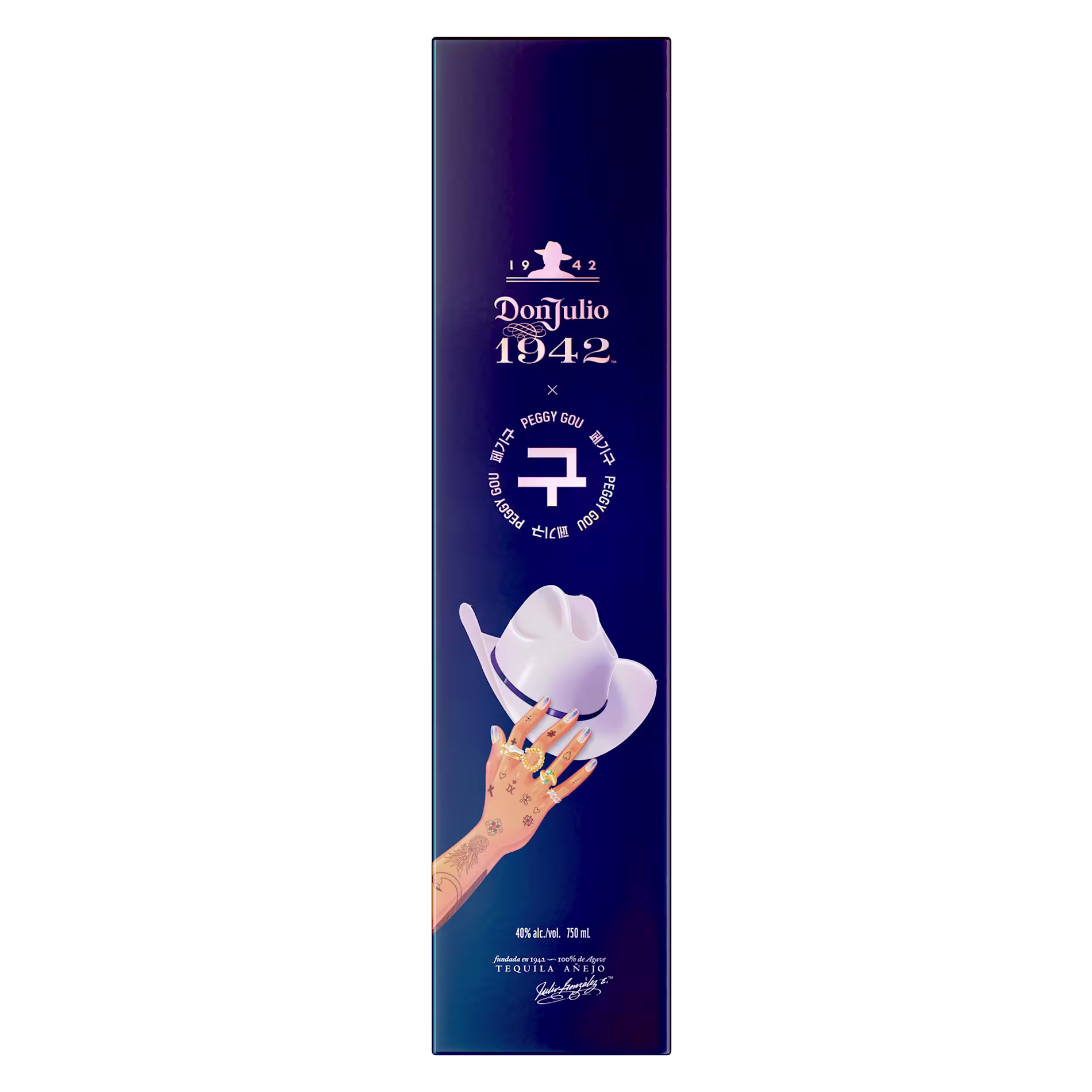 A tall, rectangular Don Julio 1942 box featuring a tattooed hand holding a white cowboy hat, collaboration branding, and logos on a dark gradient background.
