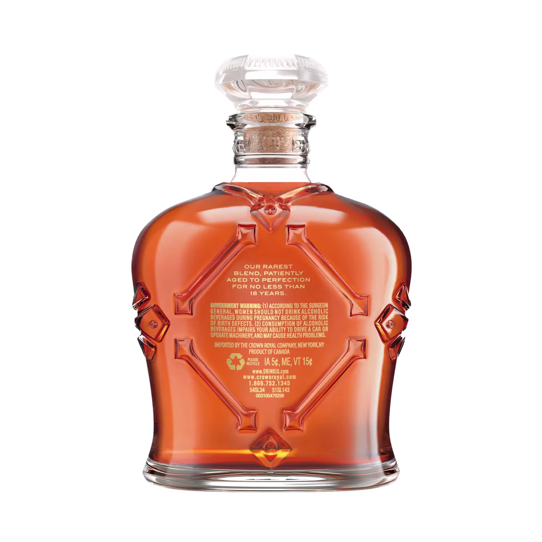 A bottle of Crown Royal whisky with an ornate glass design, filled with amber liquid and labeled with product information on the front.