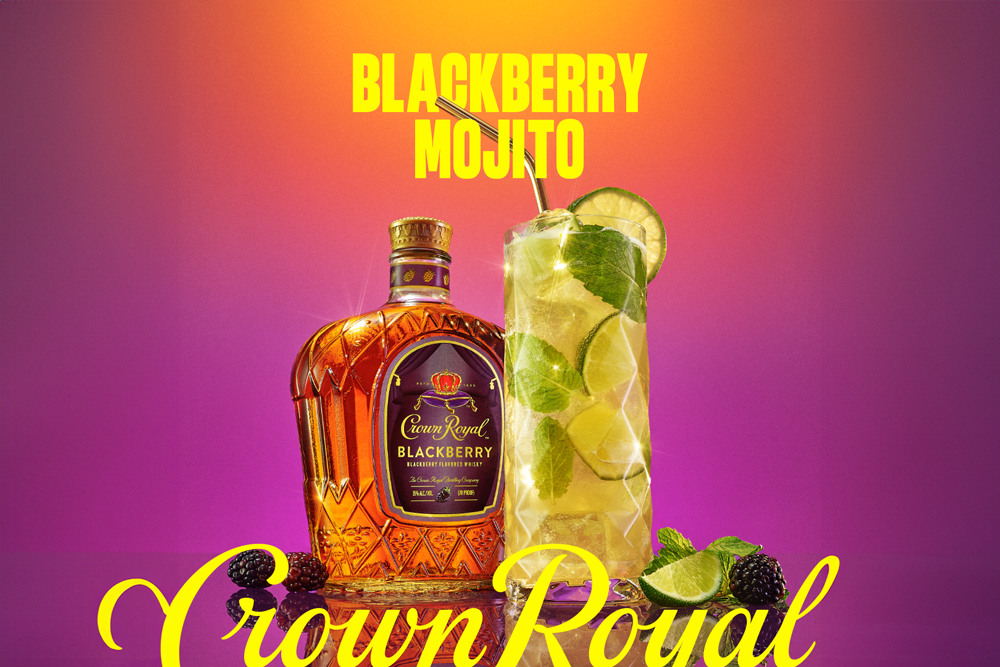 A bottle of Crown Royal Blackberry whisky and a glass of blackberry mojito with lime, mint, and blackberries on a purple and orange gradient background. Text reads Blackberry Mojito Crown Royal.