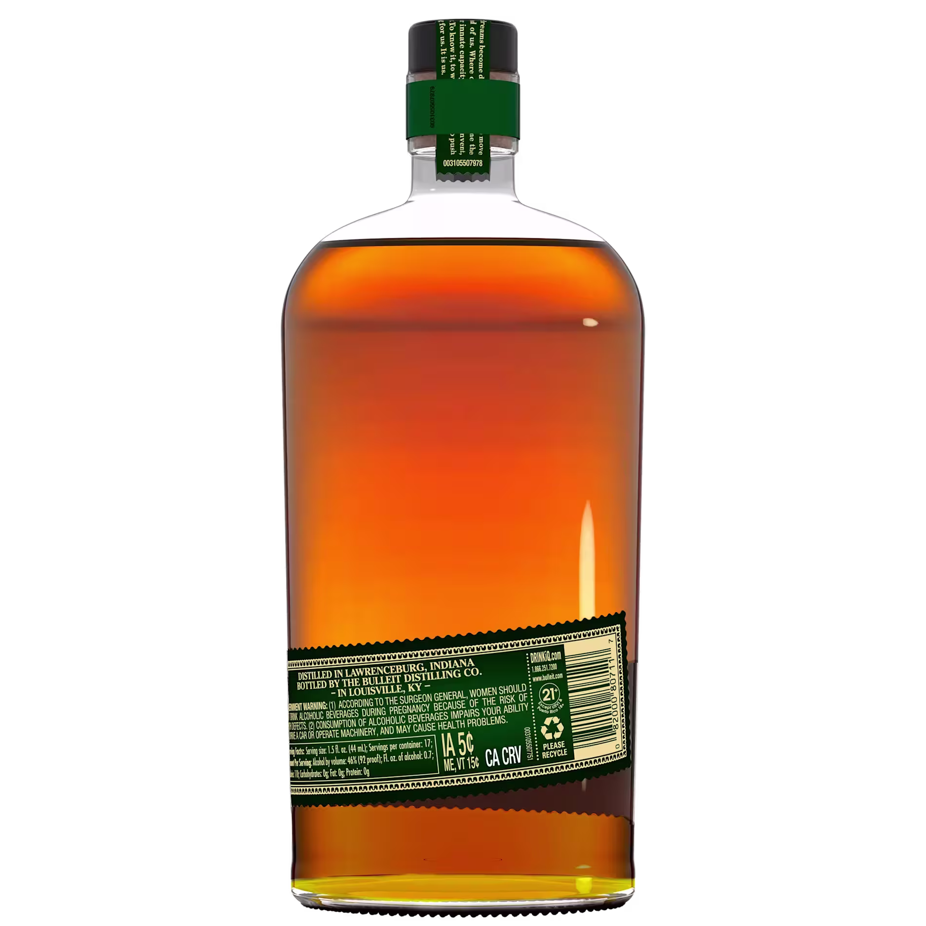 A clear glass bottle filled with amber liquid, viewed from the back, showing a green label with white and gold text and a matching green bottle cap.