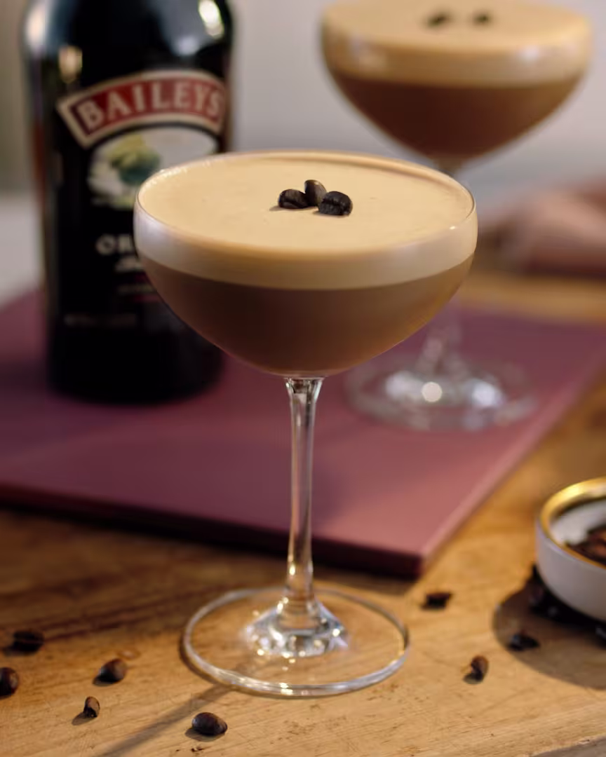 A Baileys Espresso Martini with a coffee bean garnish.