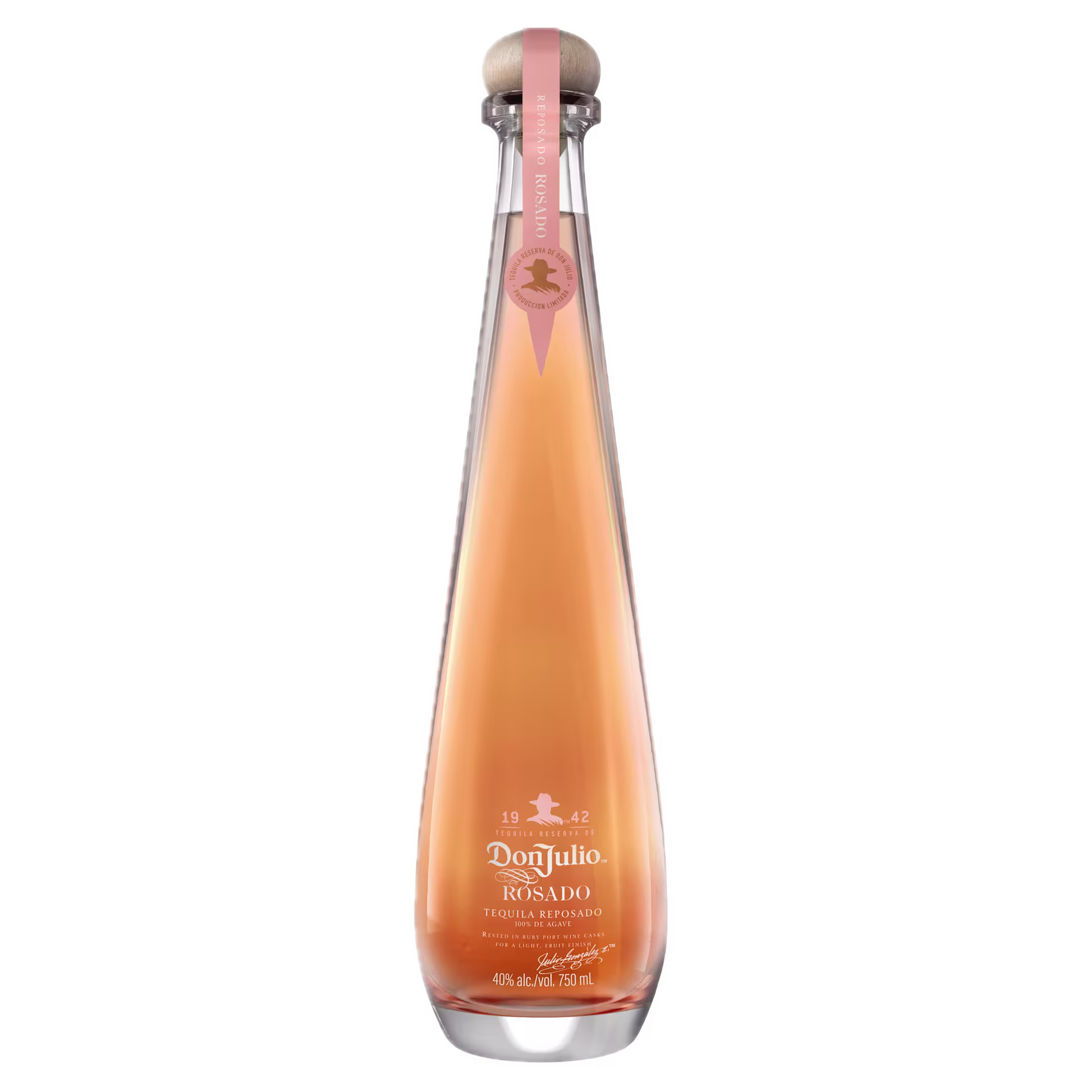A tall, clear bottle of Don Julio 1942 Rosado tequila with a pink ribbon and wooden cap, containing light pink liquid, displayed on a white background.