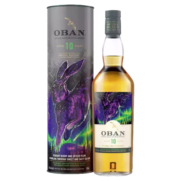 A bottle of Oban 10 Year Old whisky next to its cylindrical box, which features artwork of a purple hare and colorful aurora design.