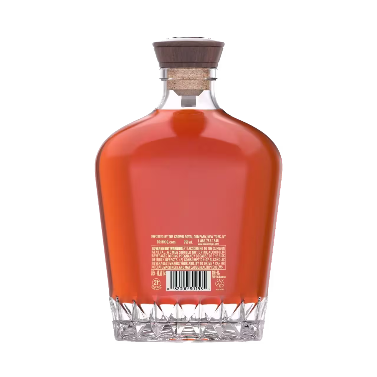 A clear glass bottle with a wooden cap, filled with amber liquid, viewed from the back showing a barcode and text on the label.