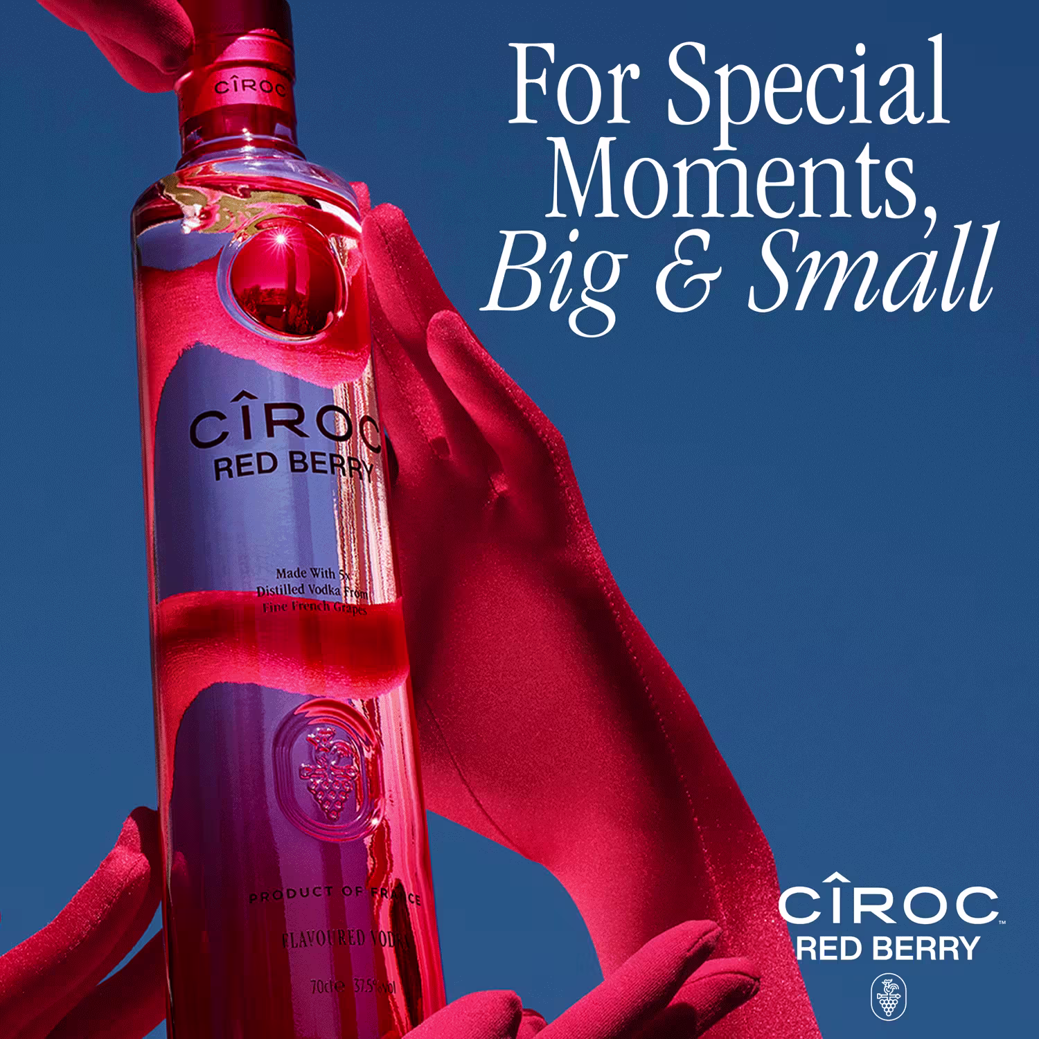 A bottle of Cîroc Red Berry vodka is held by gloved red hands against a blue background with the text, For Special Moments, Big & Small.
