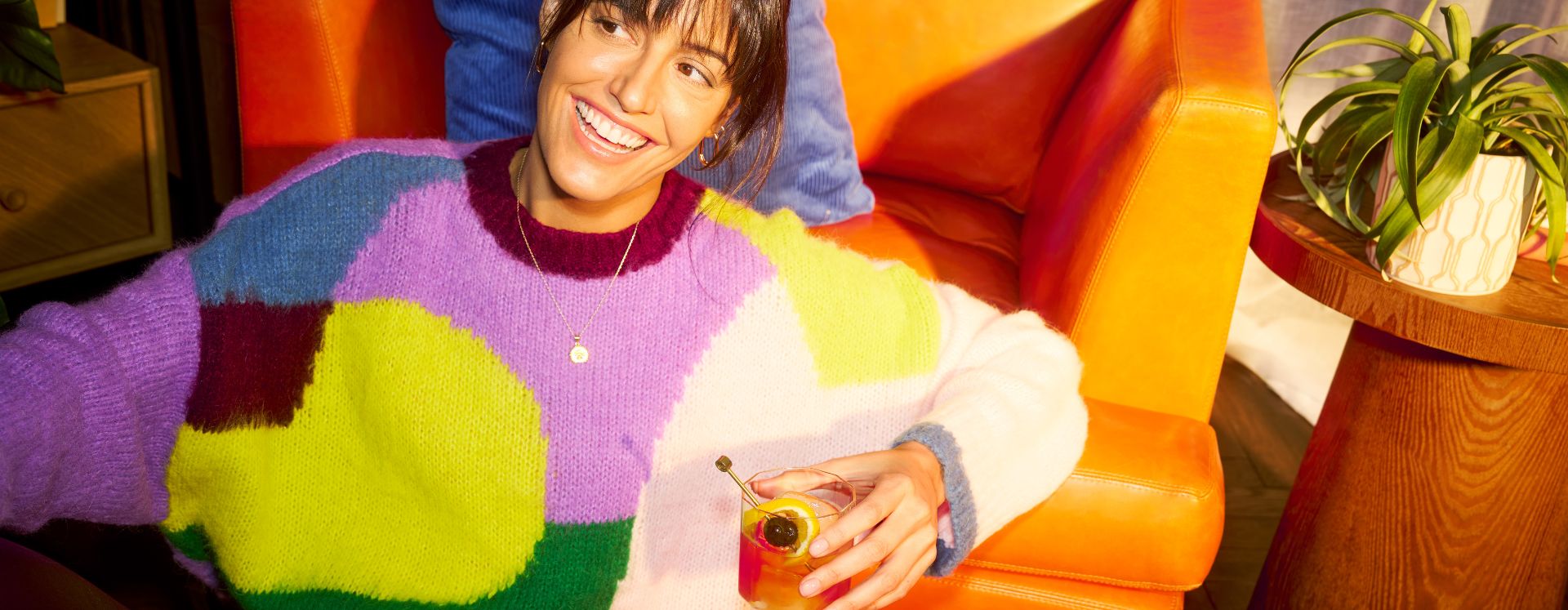 Woman drinking a whisky cocktail
