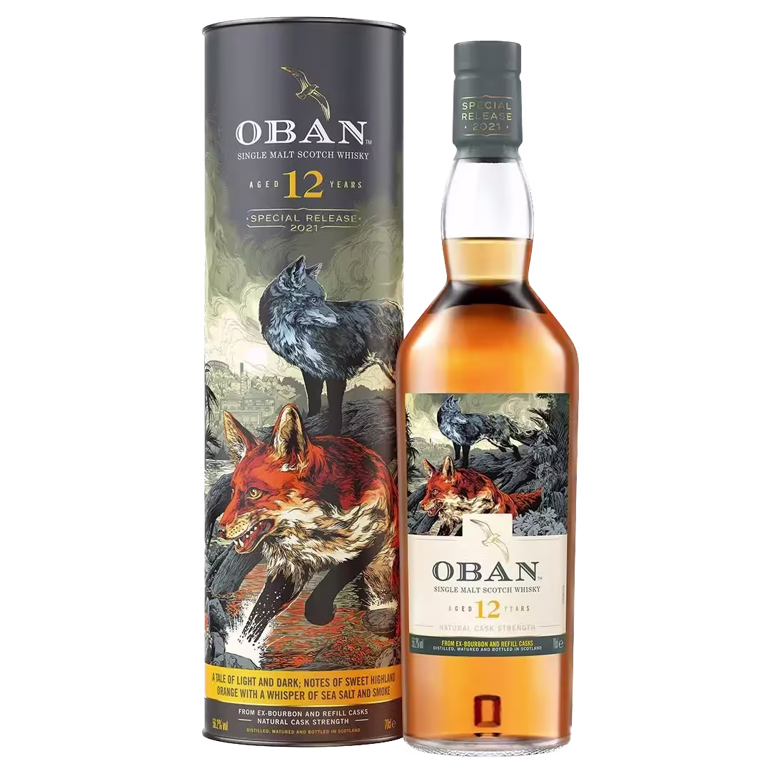 A bottle of Oban 12 Year Old Single Malt Scotch Whisky stands beside its cylindrical box, both featuring artwork of a fox and a wolf in a natural landscape.
