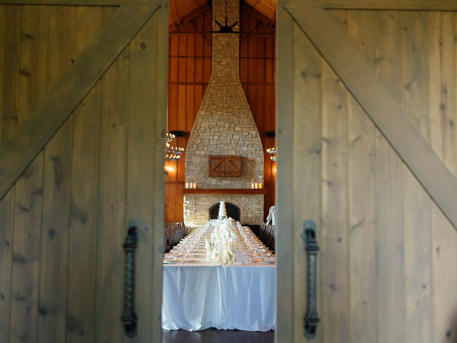 Wedding reception flowers inside the Stables at Integrity Hills