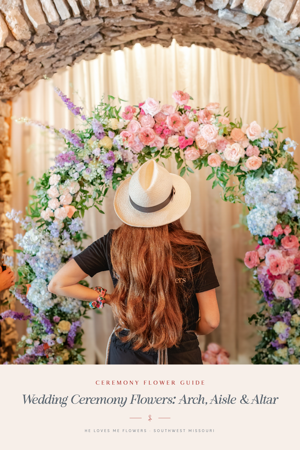 Wedding ceremony flowers guide with Charity beside a colorful floral arch