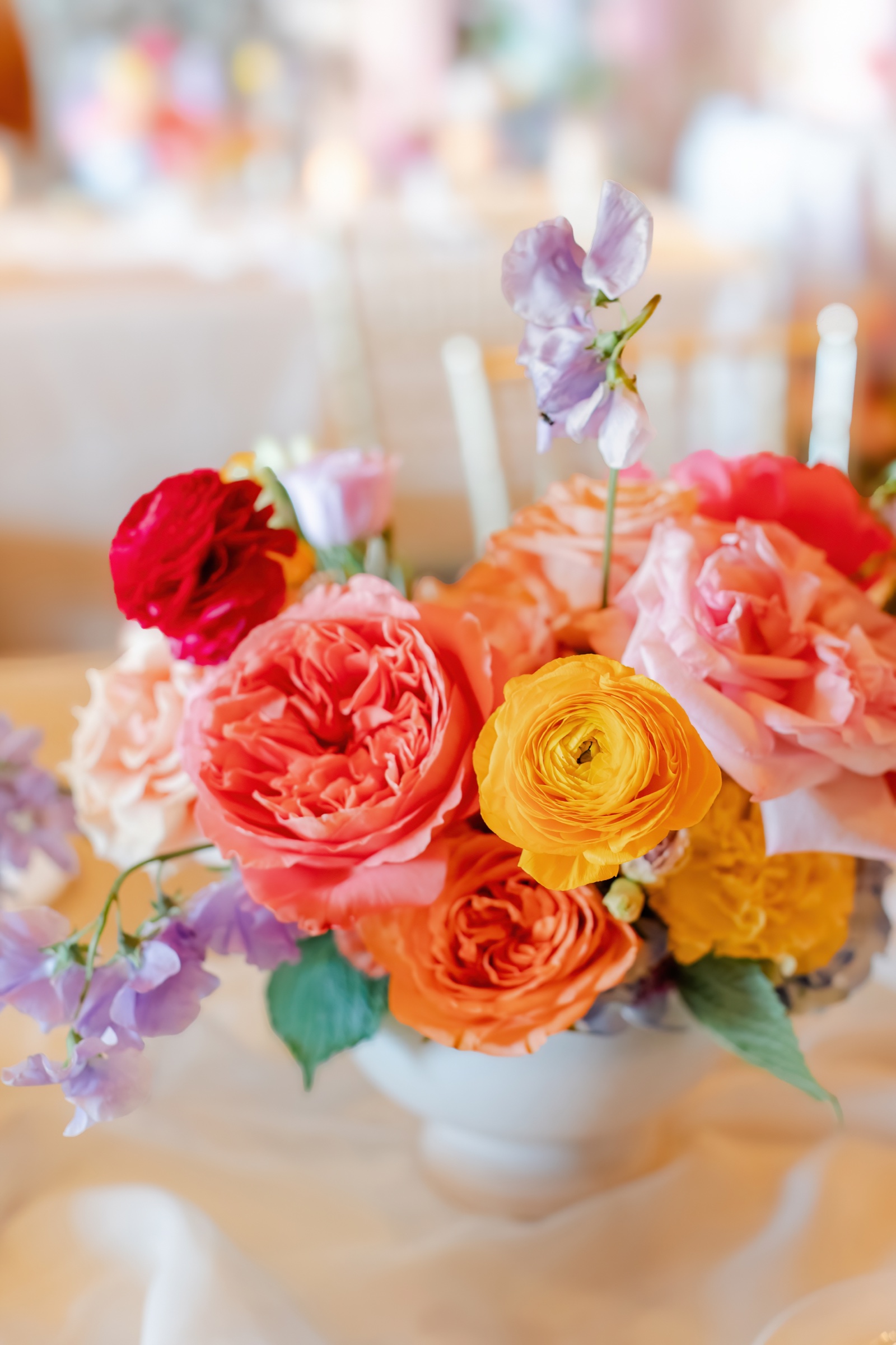 Coral, red, yellow, and lavender fall wedding flower color palette designed by He Loves Me Flowers in Southwest Missouri