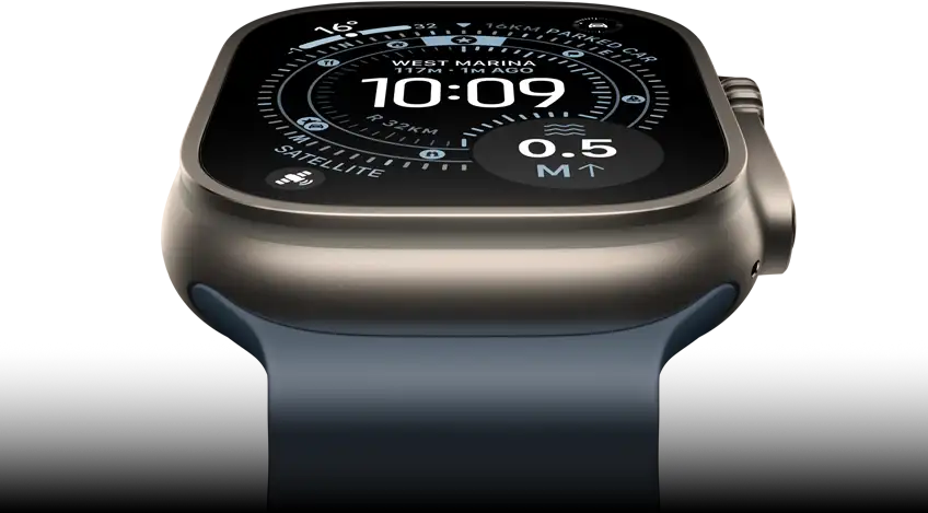 Apple Watch Ultra 3 tilted forward, natural titanium case, compass on Orienteering watch face, anchor blue Ocean Band
