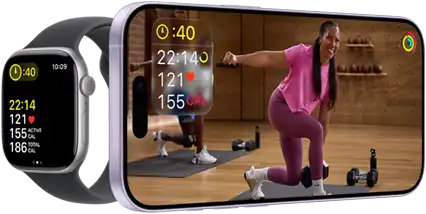 Apple Watch next to iPhone with Apple Fitness+ class on screen